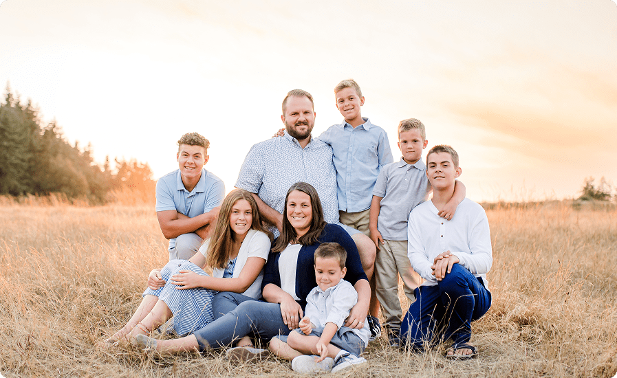 Group sitting on a golden meadow