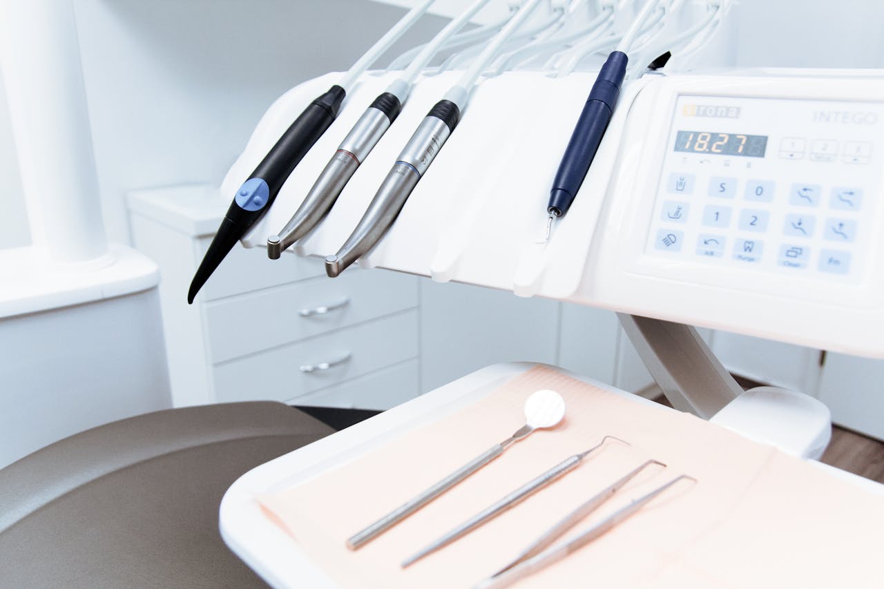 A modern dental clinic setup with tools and chair.
